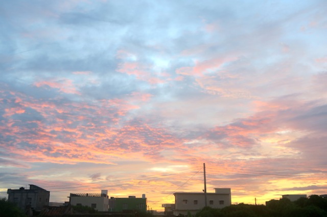 A view of the sunset from behind the clouds in Nanliao, Penghu
